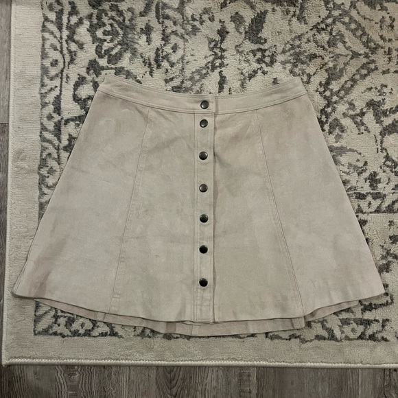 Suede-texture skirt. Faux-suede leather. Model is 5’7” and 145 lbs - Picture 2 of 2